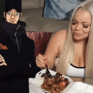 a woman is eating from a styrofoam container while a cartoon character looks on