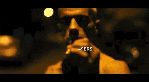a close up of a person 's hands with the word 49ers written on it .