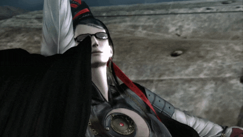 a woman wearing glasses and a hat with a red ribbon around her neck