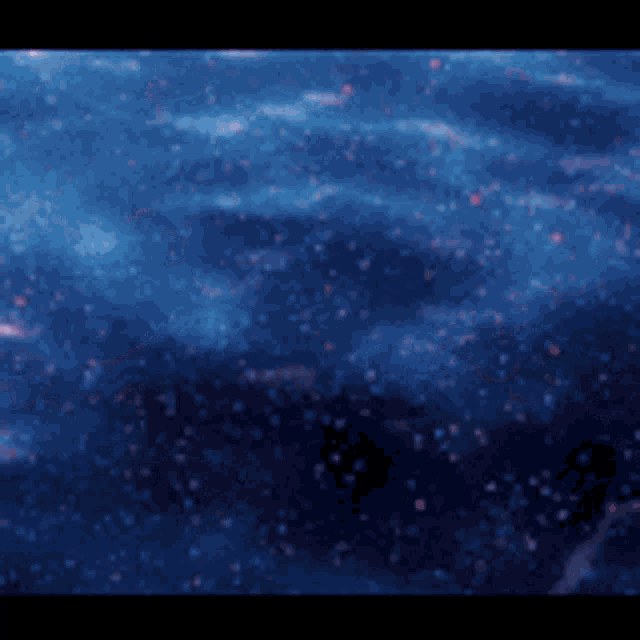 a blurred image of a body of water with bubbles coming out of it