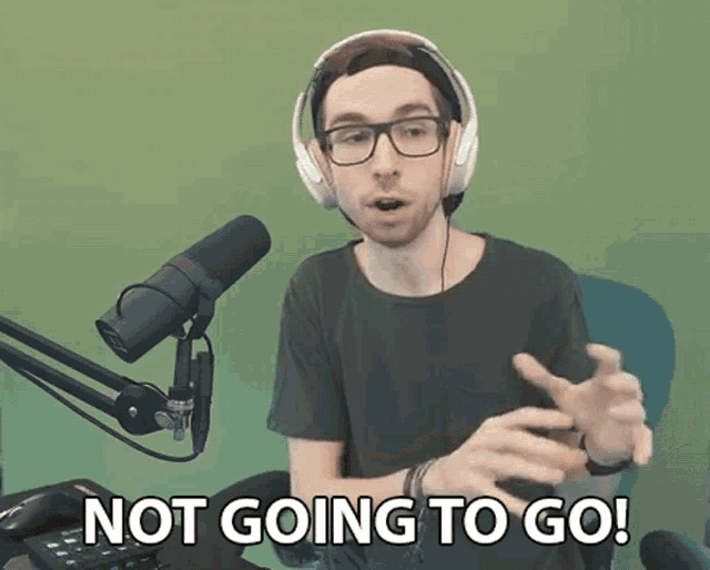 a man wearing headphones and glasses says " not going to go "