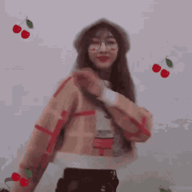 a girl wearing glasses and a hat with cherries around her