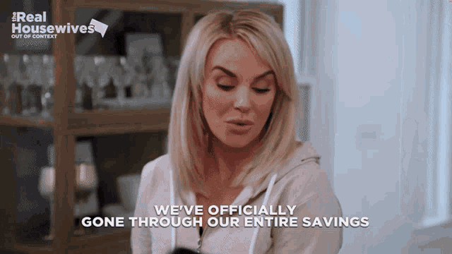 a woman says " we 've officially gone through our entire savings " on a screen