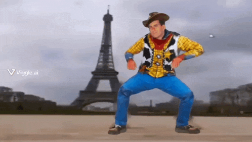 a man in a cowboy outfit is dancing in front of an eiffel tower
