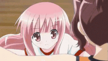a girl with pink hair is looking up at another girl
