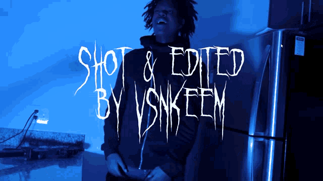 a man is standing in front of a refrigerator with the words shot & edited by vsnktem