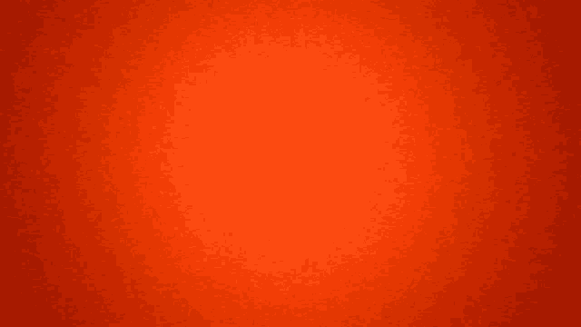 a close up of a red background that looks like a plain orange background .