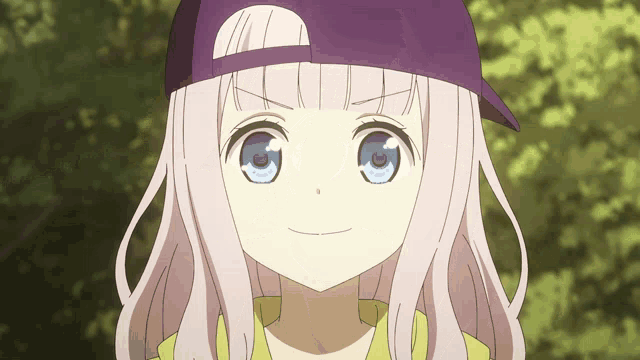 a girl wearing a purple hat and a yellow shirt