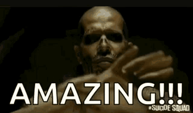 a statue of a man with fire coming out of his mouth and the words amazing suicide squad on the bottom .