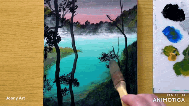 a painting of a lake with trees is being made by joony art
