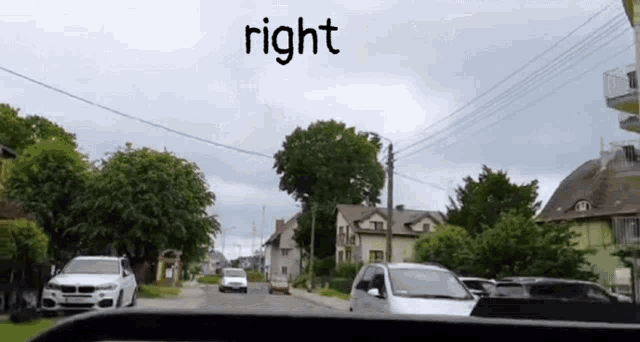 a car is driving down a street and the word right is on the bottom