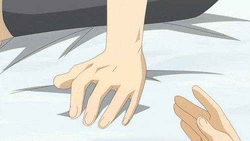 a close up of a person 's hand reaching out towards another person 's hand