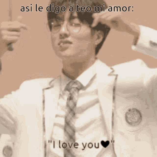 a man in a suit and tie is saying i love you