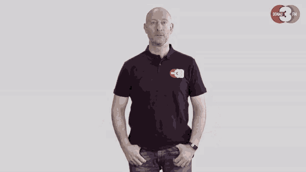 a man wearing a black shirt with cb on the front
