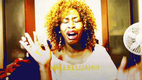 a woman singing with the word hallelujah written in red