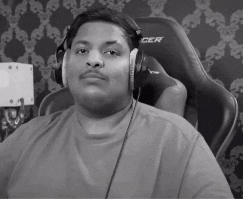 a black and white photo of a man wearing headphones and a shirt that says cer