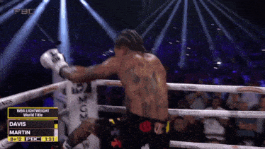 a boxing match between davis and martin is being shown on a screen