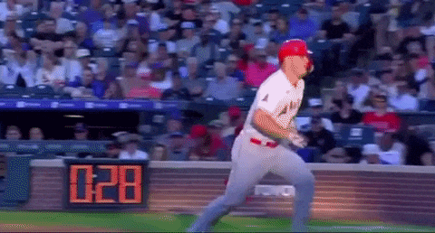 a baseball player is swinging at a ball in front of a digital scoreboard that says 0:28
