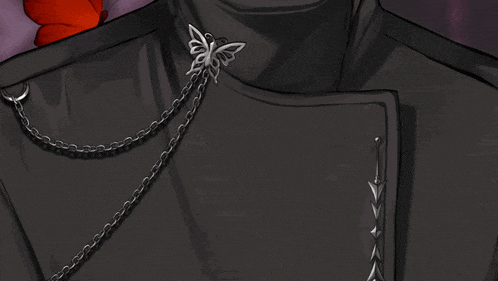 a close up of a person wearing a black jacket with a butterfly on it