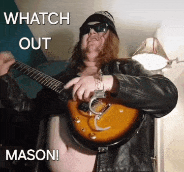 a man playing a guitar with the words whatch out mason