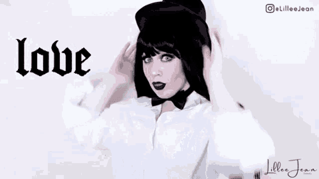 a woman wearing a black hat and a bow tie is making a funny face .