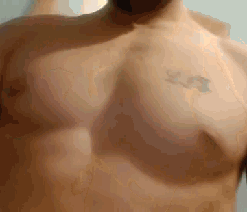 a man without a shirt has a tattoo on his chest that says u.s.
