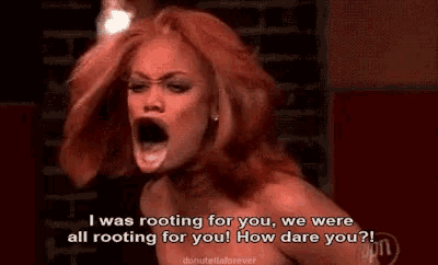 a woman with red hair is screaming and saying i was rooting for you we were all rooting for you how dare you