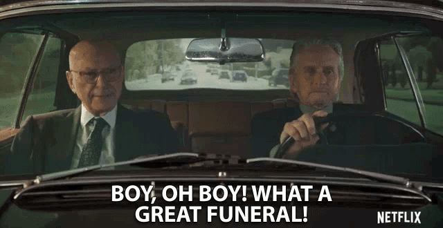 two men are sitting in a car with the words boy oh boy what a great funeral