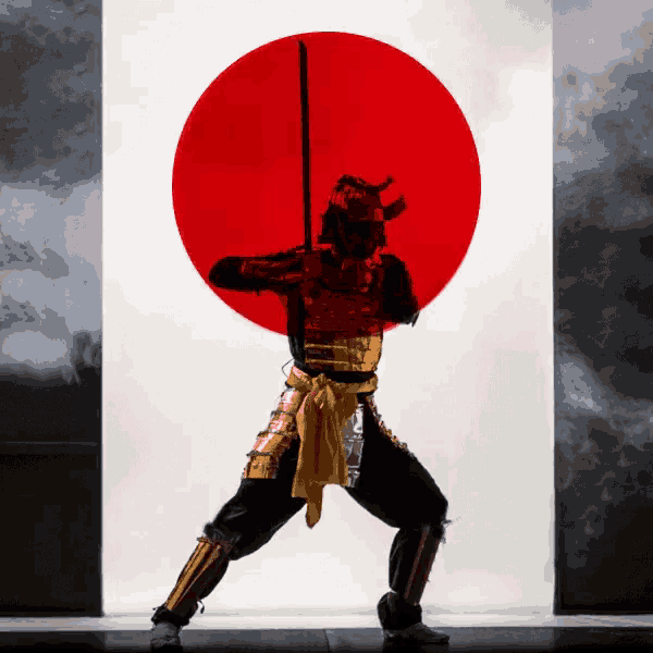 a samurai holding a sword in front of a red sun