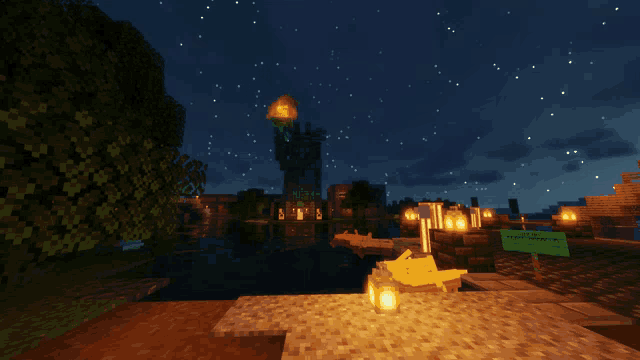 a statue of liberty is lit up at night in minecraft