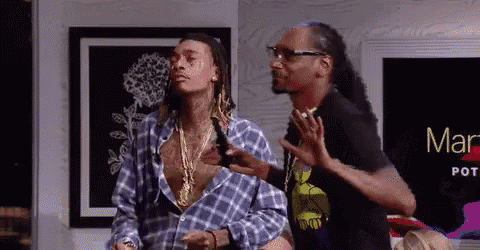snoop dogg and wiz khalifa are standing next to each other in front of a sign that says mars pot