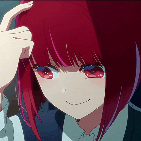 a girl with red hair and blue eyes has her hand on her head