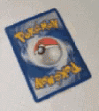 a pokemon card with a pokeball on it .
