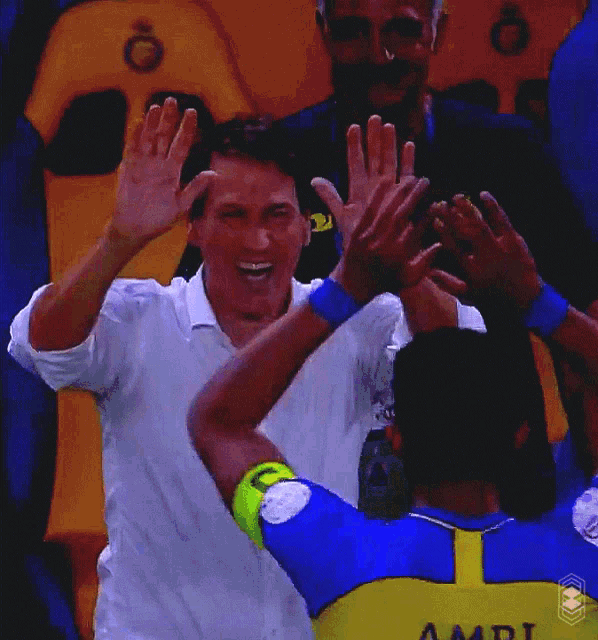 a soccer player with the name amri on the back of his shirt