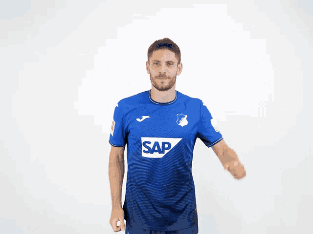 a man wearing a blue shirt that says sap