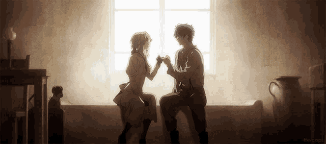 a man and a woman sitting on a couch holding hands