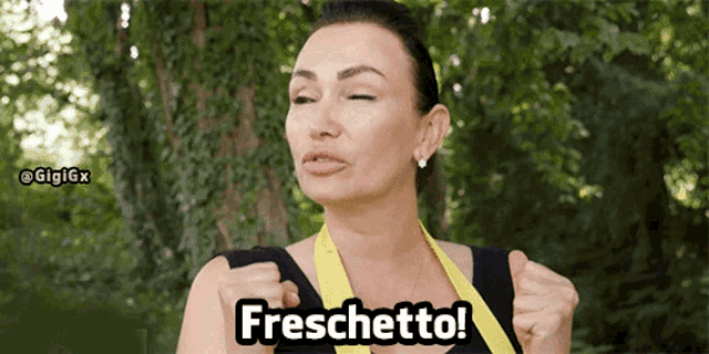 a woman wearing a yellow apron is saying freschetto