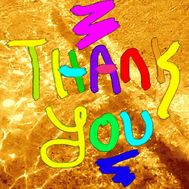 a colorful sign that says thank you on a brown background