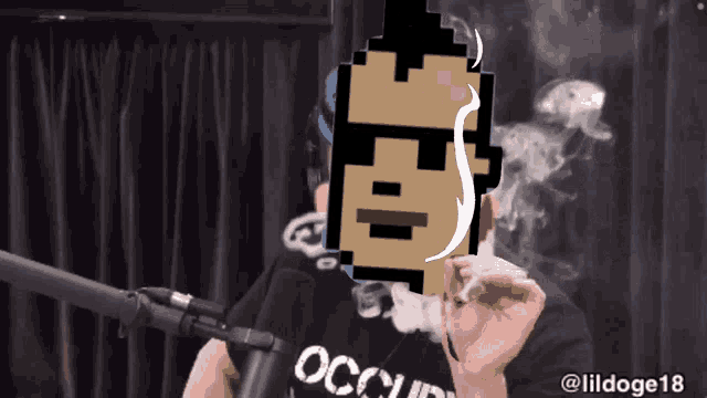 a man wearing a black shirt with the word occupy on it is smoking a cigarette
