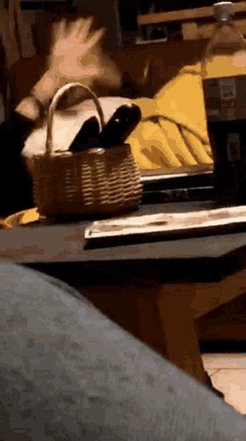 a bottle of diet coke is on a table next to a basket