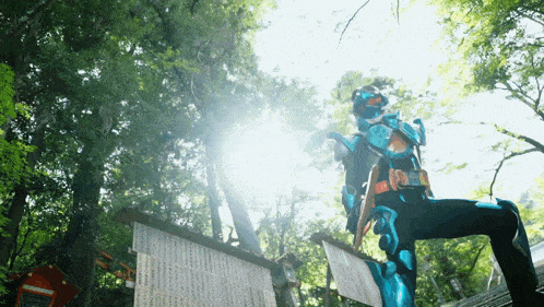 a person in a blue and black costume with a belt that says ' samurai ' on it