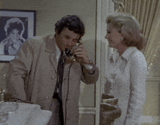 a man and woman are talking on a telephone