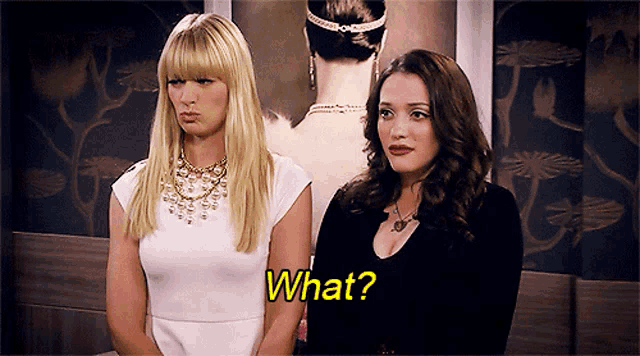 two women are standing next to each other and one of them is asking the other what