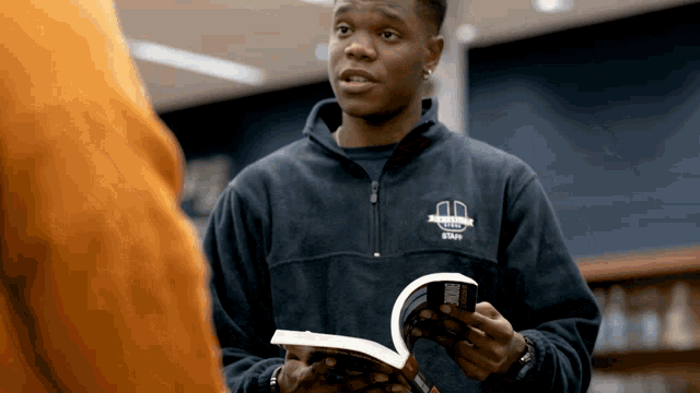 a man wearing a jacket that says ' virginia state ' on it