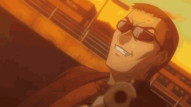 a man wearing sunglasses is pointing a gun at something