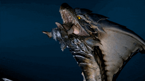 a statue of a dragon with its mouth open