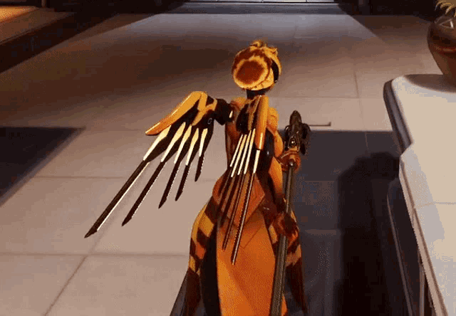 a statue of a woman with wings and a sword