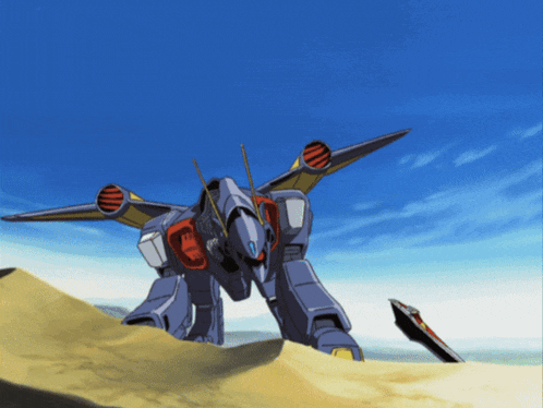 a robot is standing on top of a sandy hill