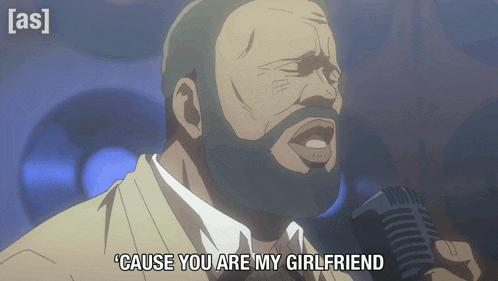 a man singing into a microphone with the words cause you are my girlfriend below him