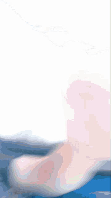 a blurry picture of a person 's feet and a white background
